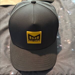 Melin Black Trucker Hat with gum Logo Patch